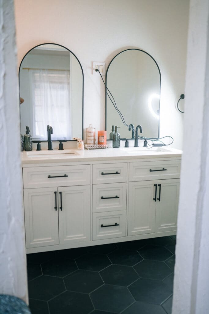 Bright white tub and shower boudoir set with black fixtures inside Lanora Ronée Photography in Fort Worth.